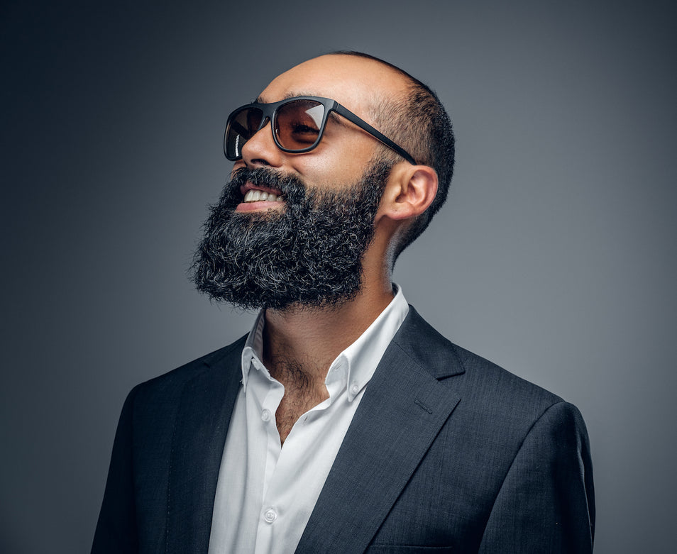 black man with full beard because of using beard oil